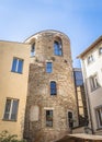 A street in Florence in Italy, with an old round brick house clenched with modern houses Royalty Free Stock Photo