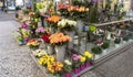 Street florist stall with roses and asters display.