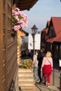 Street, flowers, lantern in beautiful cozy small town Lanckorona, Poland Royalty Free Stock Photo