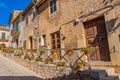 Street with flowers of Valldemossa the old mediterranean village in the mountain, landmark of Majorca island, Spain Royalty Free Stock Photo