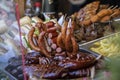 Street food with assortment of grilled sausages. Royalty Free Stock Photo