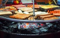 Street food background with assortment of grilled sausages Royalty Free Stock Photo