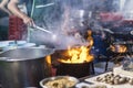 Street food in Bangkok Bangkok Thailand - Oct 24, 2020 :- Chef cooking with fire with frying pan on gas hob Royalty Free Stock Photo
