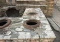 Street food bar with pots to keep food hot in the remains of Herculaneum Parco Archeologico di Ercolano