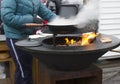 street food. cooking meat on a cone grill