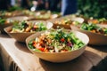 Street food festival, catering service. Vegetable salads in paper plates sold outdoors at market place Royalty Free Stock Photo