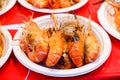 Grilled shrimp placed in a paper plate. Easy to find food along the way in Thailand. Royalty Free Stock Photo