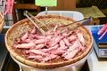 Pile of steamed squid on threshing basket at street food in Taipei, Taiwan