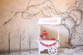 Street Food Promotional counter cart outdoors on Christmas eve. Decorative vintage white wooden retro kiosk, candy bar desserts,