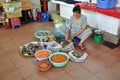 Street food in Saigon, Vietnam. Fish, shrimp and mussels