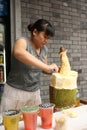 Street food seller is cutting durian in China