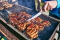 Street food. Shish kebab and maso cook on a wire rack in the fresh air