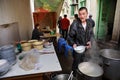Street food, sidewalk snack, cook prepares the street, Chinese dishes.