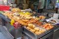 A street food stall in Hong Kong selling different types of deep fries and barbecued food. Demonstrating Asian street food culture