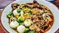 Street food in Thailand called "Kao Lao Moo Toon