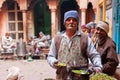 Street food trader making a dish for poor hungry customers of old city Varanasi