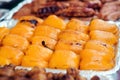 Street food at vegan festival. Grilled yellow peppers, closeup. Grilled vegetables at street food festival. Street market