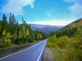 a street in front of the rocky mountains Royalty Free Stock Photo