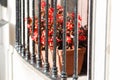 Street garden planter with flowers behind bars on the window Royalty Free Stock Photo