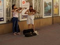 Street girls musicians playing violins