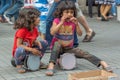 Street girls playing tambourines