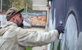 Street graffiti artist in action. Royalty Free Stock Photo