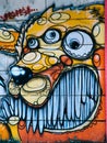 Street graffiti on the public wall abstract of lion with multiple eyes. Novi sad Serbia 08.14.2010