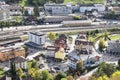 Street grid and rail way on railway station with houses and industrial buildings in average swiss village aerial view. Top view Royalty Free Stock Photo