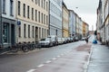 Street in Grunerlokka, a trendy hipster neighborhood in central Oslo, Cyclist riding on a wet street in the rain