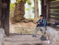 The street guitar player plays the guitar near the entrance to the tunnel, leading to the old town of Sighisoara in Romania