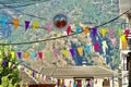 A street in GÃÂºÃÂ©jar-Sierra Spain adorned with colored banners in celebration of