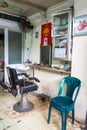 Street hairdressers on the streets of Vietnam. Hairdresser workplace. Old barber chair Royalty Free Stock Photo