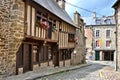 Half timbered buildings with flowers, historic town of Dinan, France Royalty Free Stock Photo