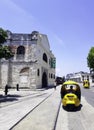 Street of Havana with old residential buildings and Cuban taxi - Havana, Cuba