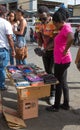 Street hawker in Jamaica trying to sell his merchandise