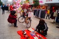 Street hawkers selling Tomatoes on sticks