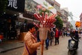 Street hawkers selling Tomatoes on sticks