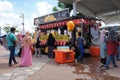 Street hawkers using food trucks to serve their business to the customer.