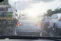 Street in the heavy rain. Water drops or rain in front of mirror of car on road or street Royalty Free Stock Photo