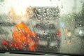 Street in the heavy rain. Water drops or rain in front of mirror of car on road or street Royalty Free Stock Photo