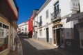 Street with historical buildings in downtown Lagos, Portugal. Lagos is a touristic destination town in Algarve, Portugal. Royalty Free Stock Photo