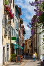 Street with historical houses in Bayonne city center. Royalty Free Stock Photo