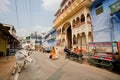 Street with holy cow and walking asian people Royalty Free Stock Photo