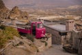 Street and homes on the slopes of the ancient fortress of Uchisar. Cappadocia, Anatolia, Nevsehir Province, Turkey Royalty Free Stock Photo