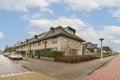 a large house with cars parked in front of it Royalty Free Stock Photo