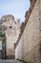 Street in the Italian Walled City of Soave with Crenellated Towers and Walls. Royalty Free Stock Photo