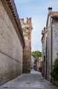 Street in the Italian Walled City of Soave with Crenellated Towers and Walls. Royalty Free Stock Photo