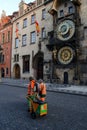 Street janitors on shift near Astronomic clock tower