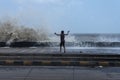 Street kids enjoying high waves during mumbai Cyclone at worli sea face,Mumbai,Maharashtra,India