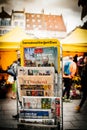 Street kiosk with multiple newspapers on sale